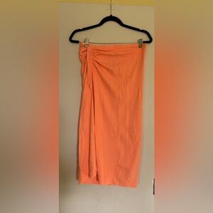 Neon orange maxi skirt with slip on the side